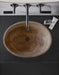 Noce travertine oval vessel sink size (W)16" (L)21" (H)6" SKU-NTRVS36 installed on bathroom top view