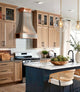 Custom Curved Stainless Steel Range Hood with Light Bronze Straps