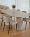 Troia Light Travertine Oval Dining Table with Fluted Round Legs (W)40" (L)75" (H)30" living room view beige color chairs wooden floors